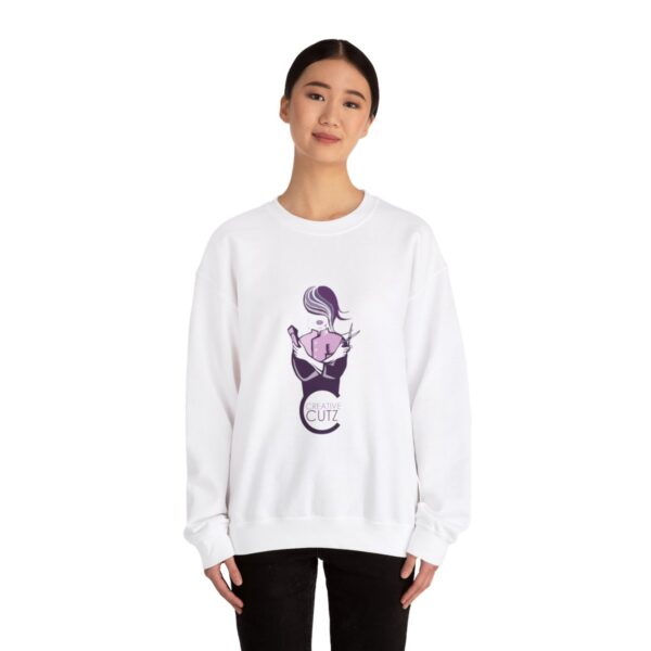 A woman wearing a white sweatshirt with an image of a cat.