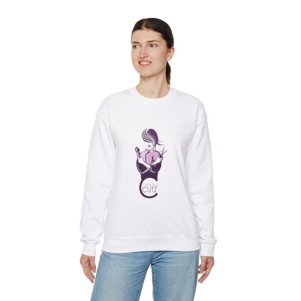 A woman wearing a white sweatshirt with an image of a cat.