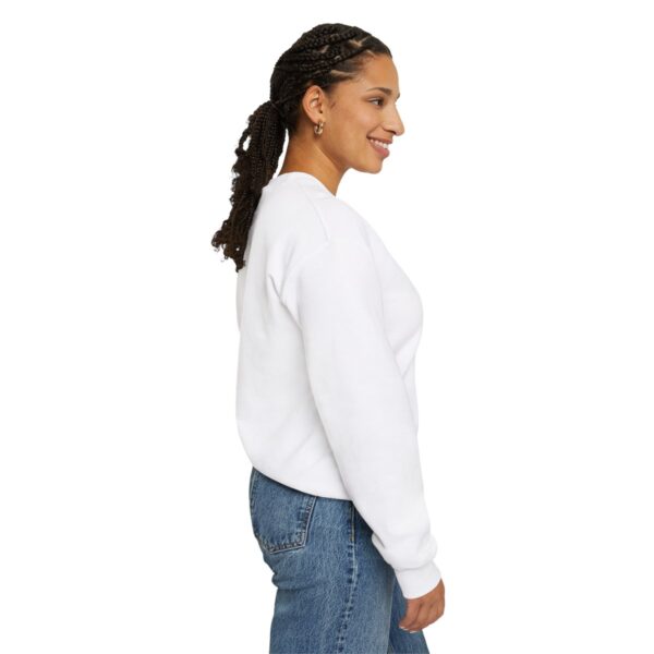 A woman with long hair is wearing jeans and white sweatshirt.