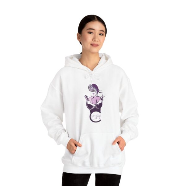 A woman wearing a white hoodie with a purple dragon on it.