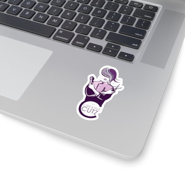 A laptop with a sticker of a person holding a basketball.